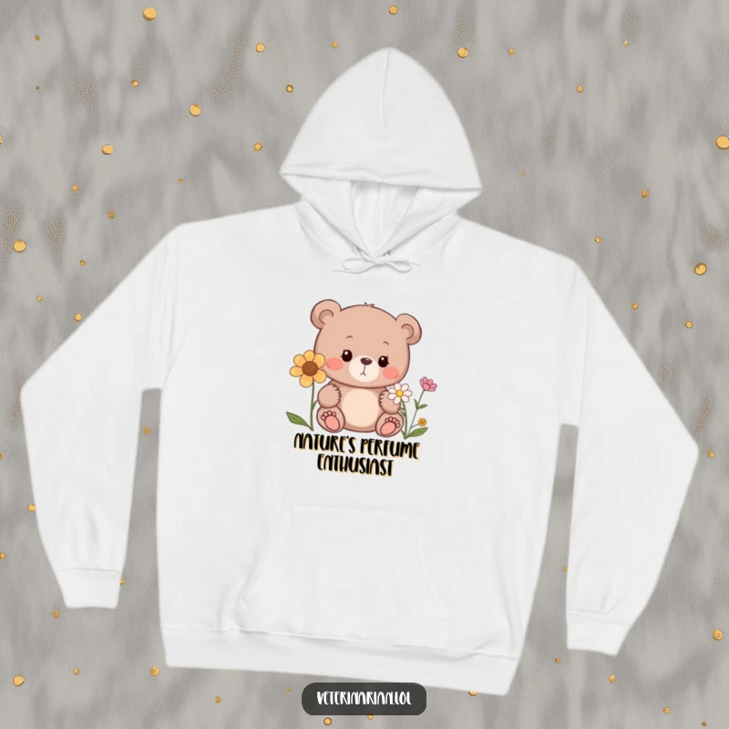Funny bear hoodie, a curious bear sniffing a flower with a gentle expression, ideal for cozy moments.