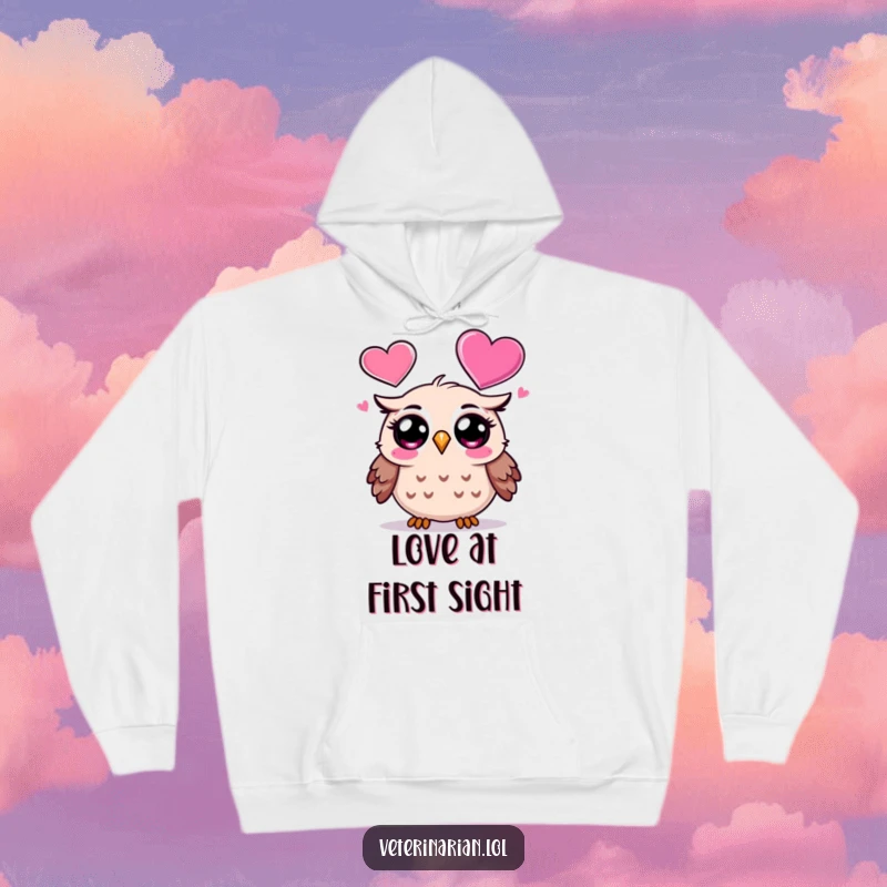 Funny Owl Hoodie: A surprised cartoon owl looks with wonder at a large, floating heart icon, a cozy and humorous funny gift.