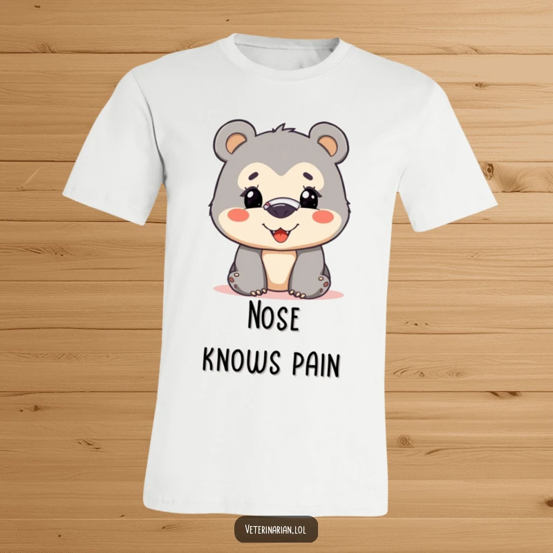 Funny bear cub t-shirt showing a curious cub with a bandage on its nose, bravely smiling, embodying a resilient and humorous spirit.